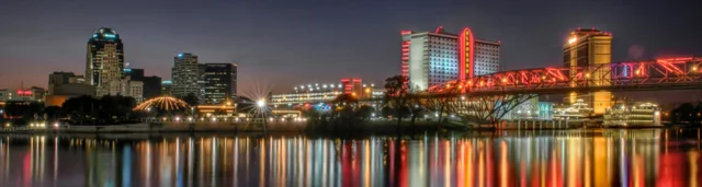 Downtown Shreveport skyline at night reflected in the Red River